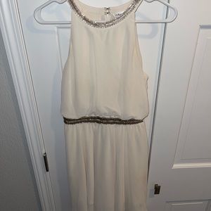 Marineblu White with gold sparkly detailing. Halter neck. Size Small